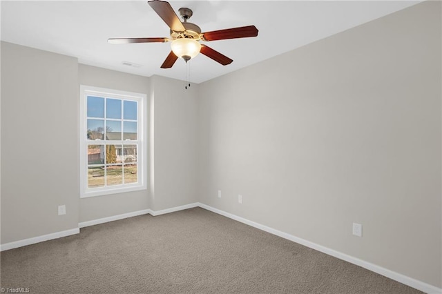 empty room featuring carpet floors and ceiling fan