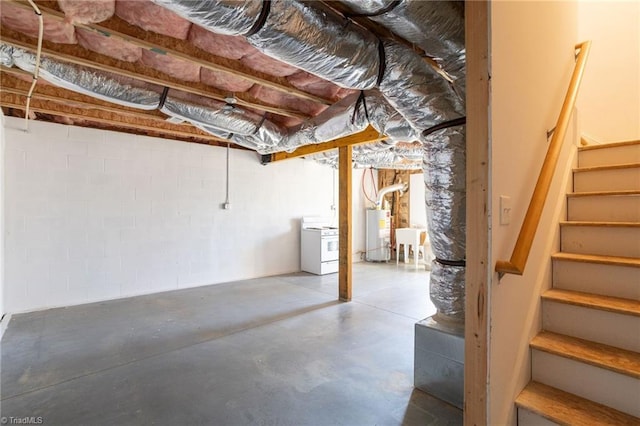 basement featuring sink, washer / dryer, and water heater