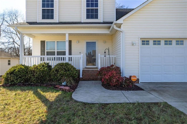 view of front of home featuring a garage, covered porch, and a front lawn