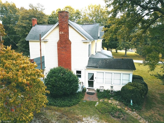 view of home's exterior featuring a yard