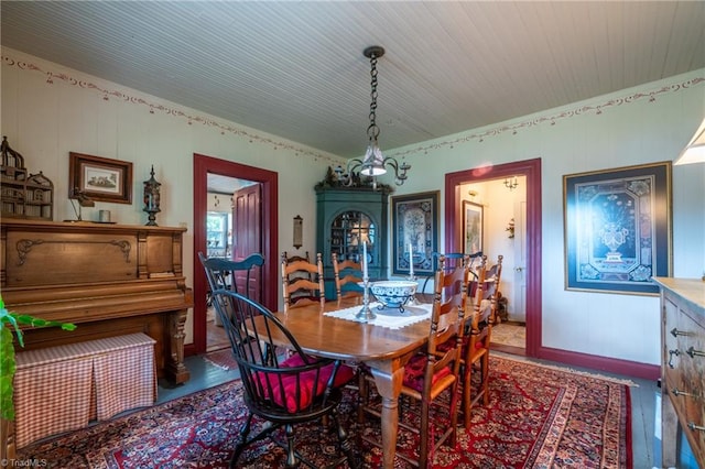 dining space featuring a notable chandelier