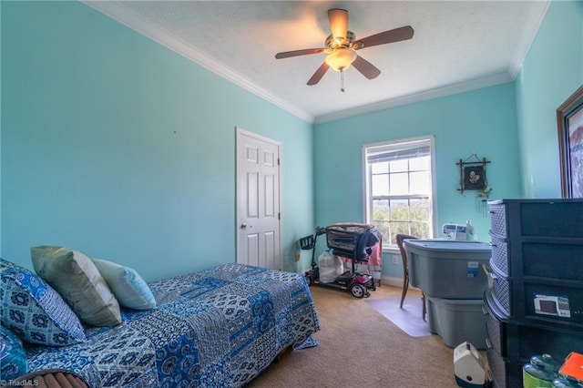 carpeted bedroom featuring ornamental molding and ceiling fan