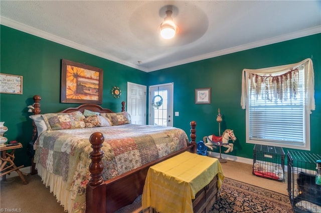 carpeted bedroom featuring ceiling fan and crown molding