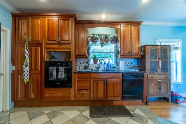 bar with sink, light hardwood / wood-style flooring, black appliances, and ornamental molding