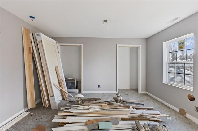 interior space with visible vents and baseboards