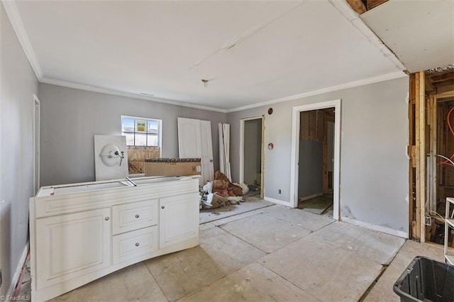 interior space with crown molding and white cabinets