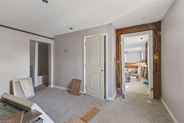 interior space with a barn door and baseboards