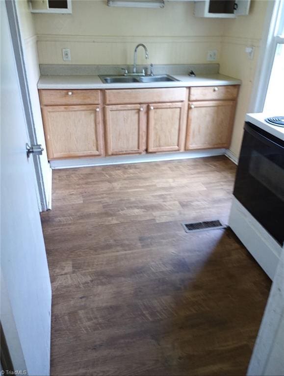301 N 7th Ave, Mayodan, NC 27027 - kitchen featuring stove, light wood-style floors, and light countertops