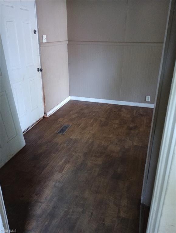 301 N 7th Ave, Mayodan, NC 27027 - empty room with a decorative wall and dark wood finished floors