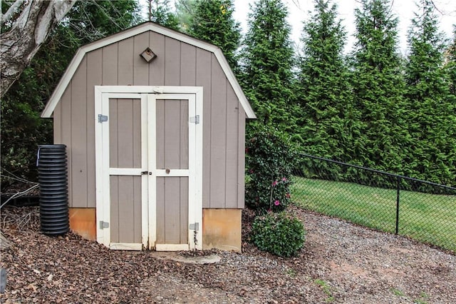 view of shed with fence