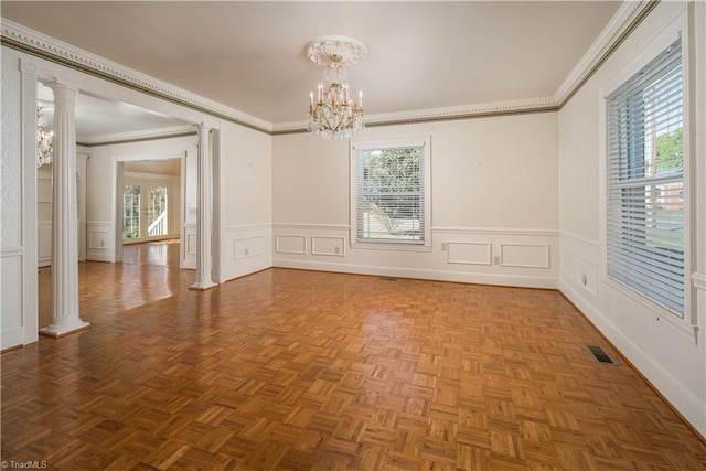 empty room with parquet flooring, ornamental molding, and a healthy amount of sunlight