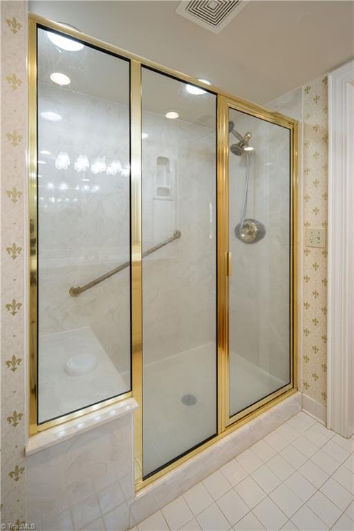 bathroom featuring tile patterned flooring and an enclosed shower