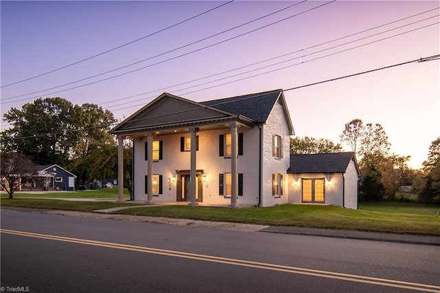 view of front of property with a yard