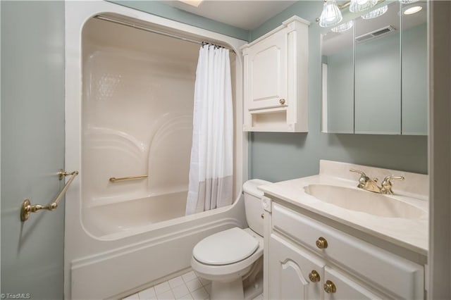 full bathroom with vanity, toilet, tile patterned floors, and shower / tub combo