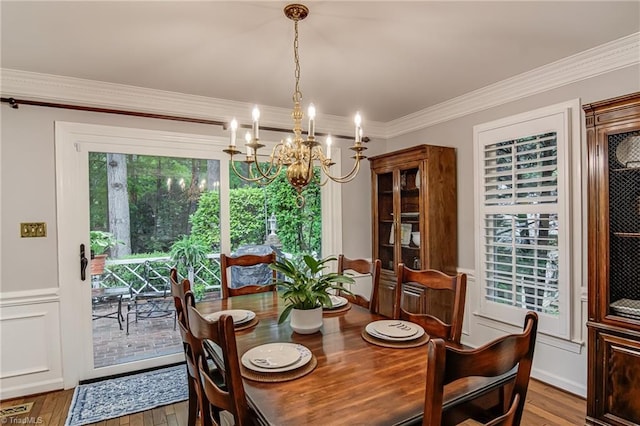 226 Cedar Trl, Winston-Salem, NC 27104 - dining space with a chandelier, ornamental molding, and wood finished floors