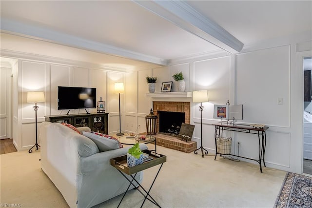 226 Cedar Trl, Winston-Salem, NC 27104 - carpeted living room featuring a decorative wall, beam ceiling, a fireplace, and ornamental molding