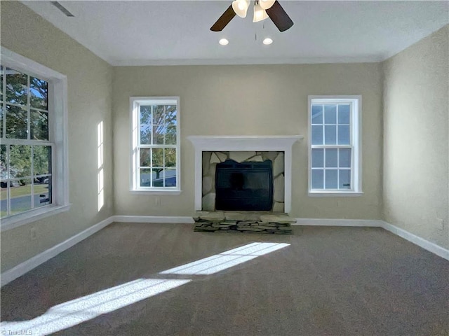 unfurnished living room with carpet flooring and ceiling fan