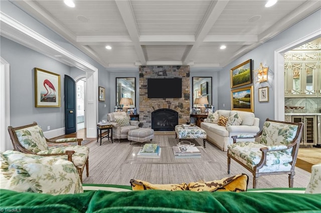 2990 Reynolds Sq, Winston-Salem, NC 27106 - living room with wine cooler, beamed ceiling, wood finished floors, a stone fireplace, and recessed lighting