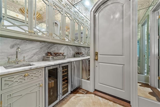 2990 Reynolds Sq, Winston-Salem, NC 27106 - indoor wet bar with wine cooler, backsplash, and light wood-style flooring