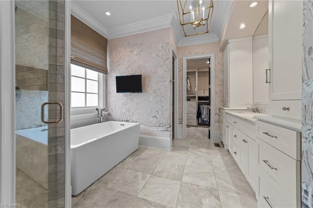 2990 Reynolds Sq, Winston-Salem, NC 27106 - full bath featuring a walk in closet, crown molding, a soaking tub, vanity, and a chandelier