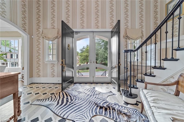 2990 Reynolds Sq, Winston-Salem, NC 27106 - entrance foyer with french doors, wallpapered walls, wood finished floors, and stairs