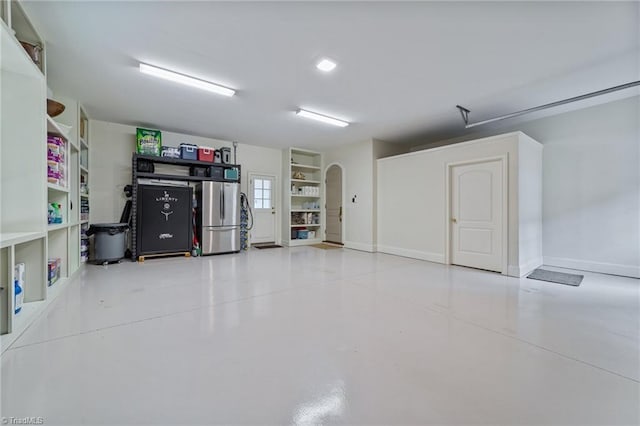 2990 Reynolds Sq, Winston-Salem, NC 27106 - garage featuring freestanding refrigerator and baseboards