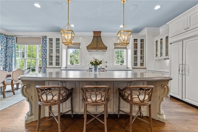 2990 Reynolds Sq, Winston-Salem, NC 27106 - kitchen featuring paneled fridge, ornamental molding, plenty of natural light, a center island, and white cabinetry