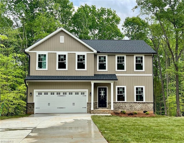 craftsman inspired home featuring roof with shingles, an attached garage, concrete driveway, and brick siding