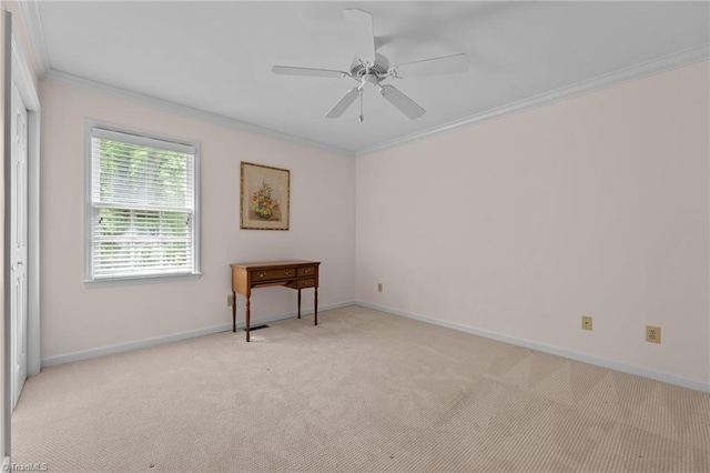 unfurnished room with baseboards, ornamental molding, light carpet, and a ceiling fan