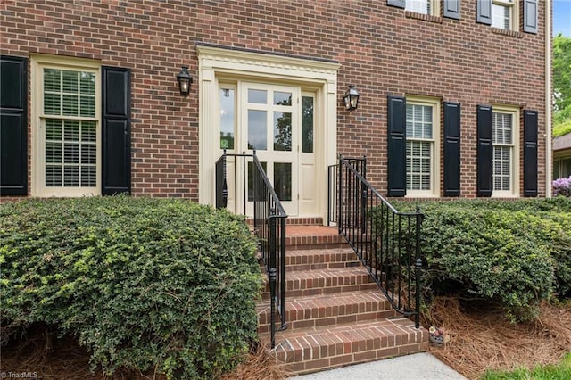 property entrance with brick siding