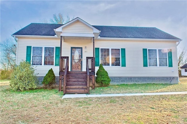 view of front of property with a front lawn