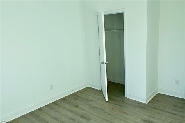 unfurnished bedroom with a closet and light hardwood / wood-style flooring