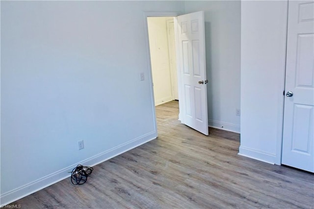 unfurnished bedroom with light wood-type flooring