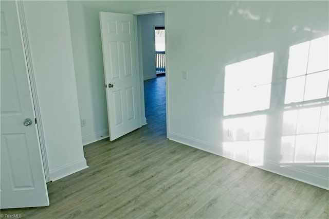 spare room with light hardwood / wood-style flooring