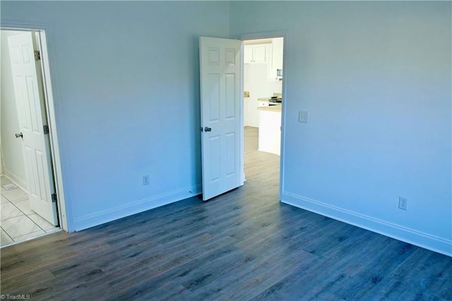 unfurnished room featuring wood-type flooring