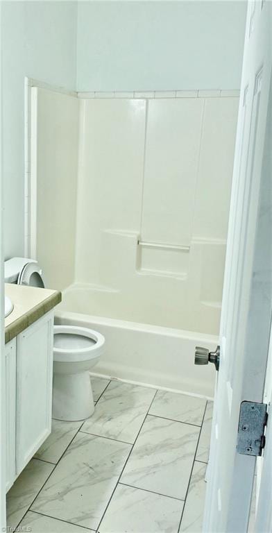 full bathroom featuring washtub / shower combination, vanity, and toilet