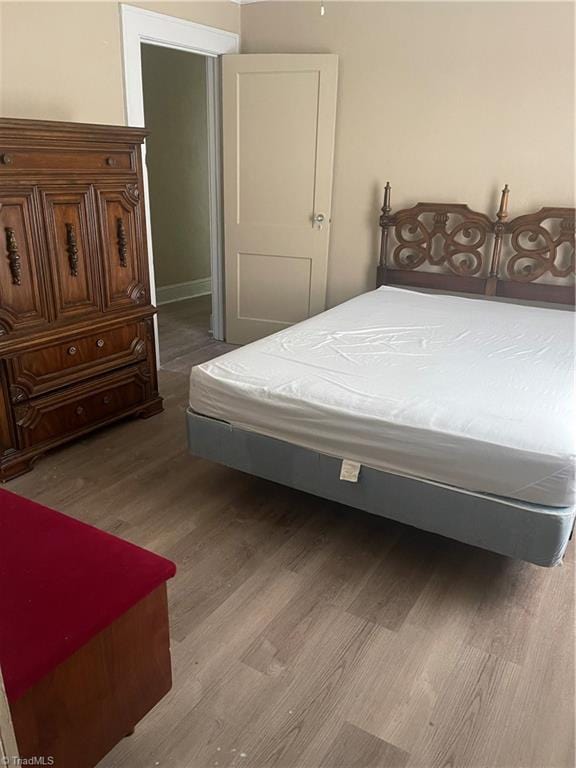 bedroom featuring hardwood / wood-style flooring