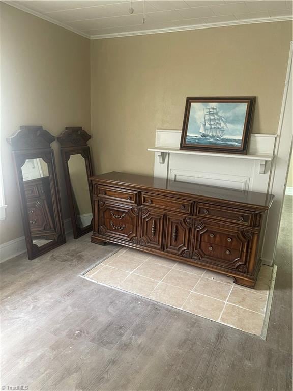 interior space with light wood-type flooring and ornamental molding