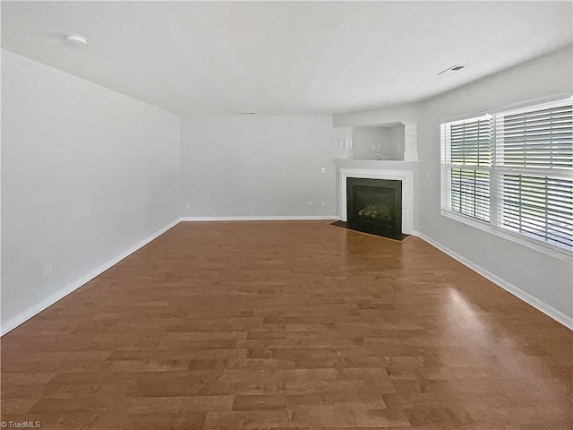 unfurnished living room with hardwood / wood-style floors