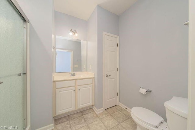 5306 Forester Dr, High Point, NC 27265 - full bath featuring toilet, vanity, a stall shower, and baseboards