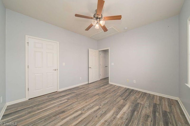 5306 Forester Dr, High Point, NC 27265 - unfurnished bedroom with attic access, wood finished floors, and baseboards