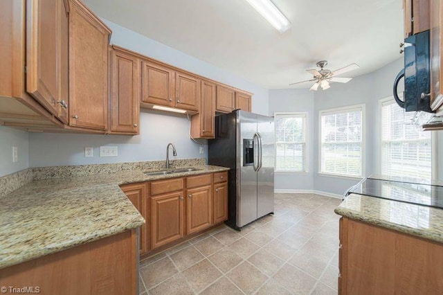 5306 Forester Dr, High Point, NC 27265 - kitchen featuring a sink, stainless steel refrigerator with ice dispenser, black microwave, ceiling fan, and brown cabinetry