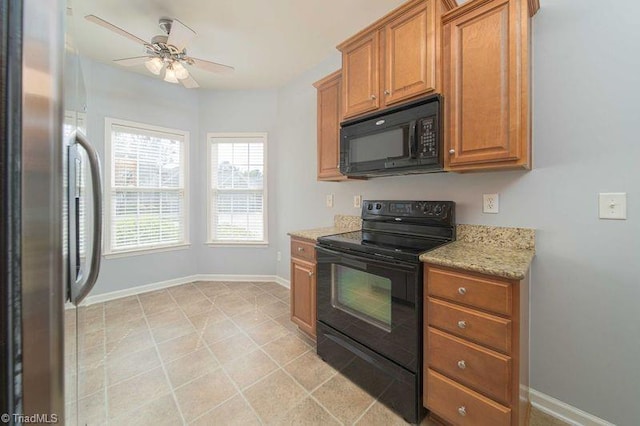 5306 Forester Dr, High Point, NC 27265 - kitchen with black appliances, a ceiling fan, baseboards, and brown cabinets