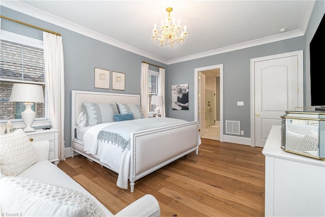 bedroom featuring baseboards, visible vents, light wood-style flooring, crown molding, and a notable chandelier