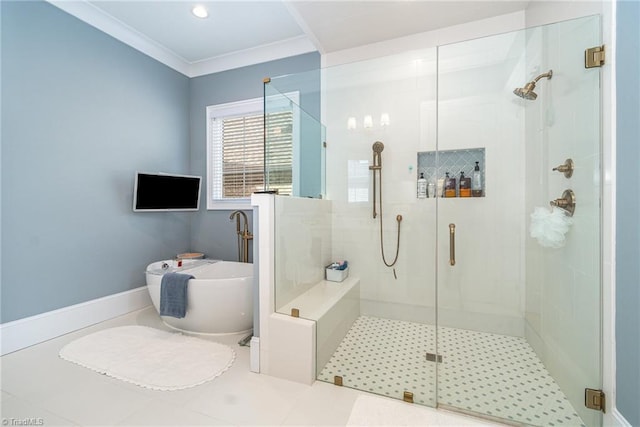 bathroom featuring a freestanding bath, a stall shower, and crown molding