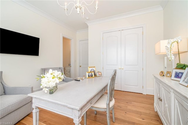 office with baseboards, light wood-style floors, a chandelier, and crown molding