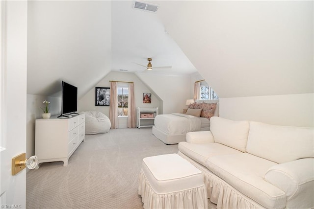 bedroom featuring visible vents, light colored carpet, a ceiling fan, and lofted ceiling