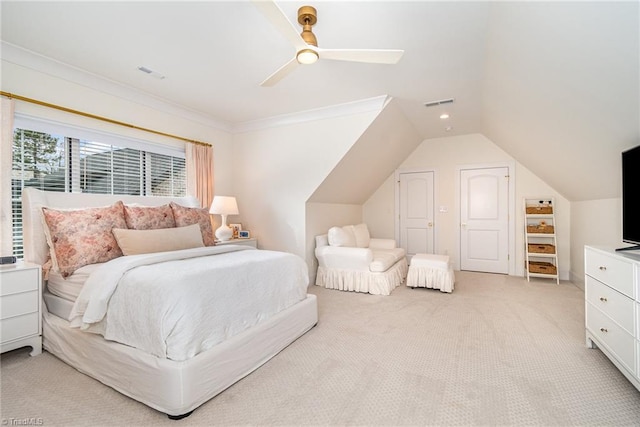 bedroom with vaulted ceiling, crown molding, visible vents, and light carpet