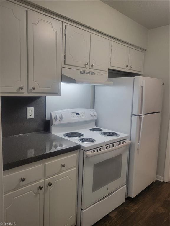 kitchen with white cabinetry, dark hardwood / wood-style flooring, and white appliances