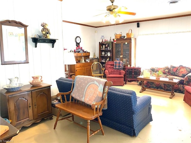 interior space featuring ornamental molding and ceiling fan